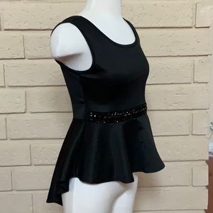 Tank top with beaded waist lineand and in a style of waved edge. new without tag